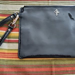 Cole Haan black patent leather wristlet.